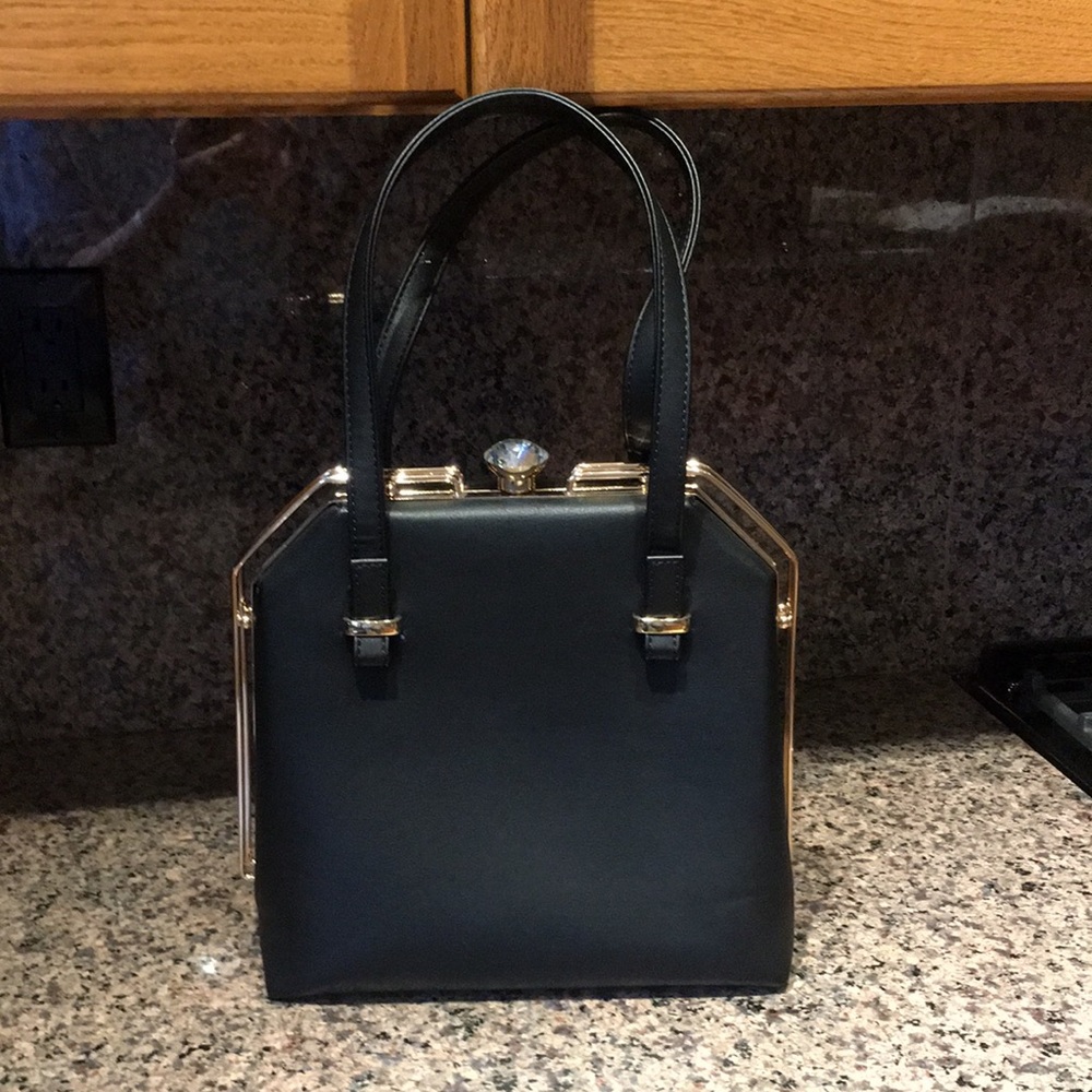 Gorgeous Black Pocketbook with faux
diamond closure